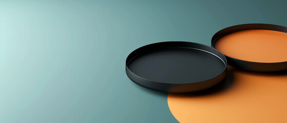 Two Black Plates on Table