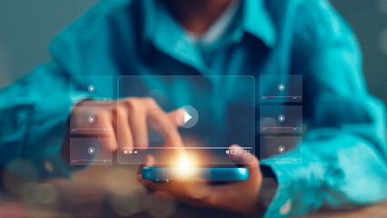 A man search for video content on internet, to watch online entertainment streaming, watch online streaming video. online learning, watch video and live, listen to music, shows or online lessons.