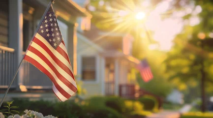 Fotobehang American flag displayed on house corner with blurred background © pijav4uk