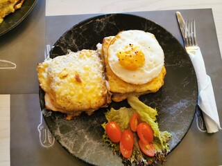 A plate filled with scrambled eggs, hearty vegetables, and vibrant colors, offering a nutritious and delicious combination.