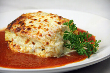 Lasagna with Marina Sauce Italian Restaurant Food Pasta White Dish Side Angle