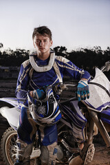 Sport, portrait and man with off road motorcycle, confidence and gear for competition, race or...