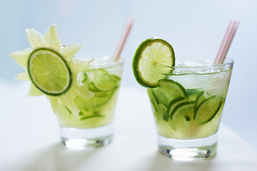 Cocktail, alcohol and mojito with lime for drink on table for party, club and bar or restaurant....