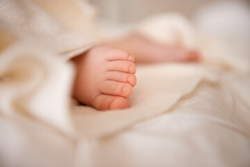 Baby, feet and toes or blanket as closeup for childhood development or nursery sleeping, relax or...