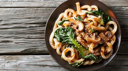 Asian vegetarian food udon noodles with baby bok choy, shiitake mushrooms, sesame and pepper close-up on a plate. horizontal top view - obrazy, fototapety, plakaty