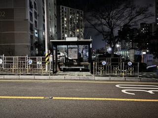 A quiet Korean bus stop after midnight