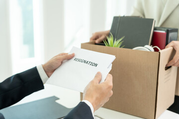 resignation, leave, quit, Business owner read resignation letter from employee. staff is lifting a brown paper box that holds personal items. , job placement and vacancies, resignation letter