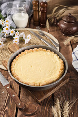 sour cream pie on a wooden background table setting