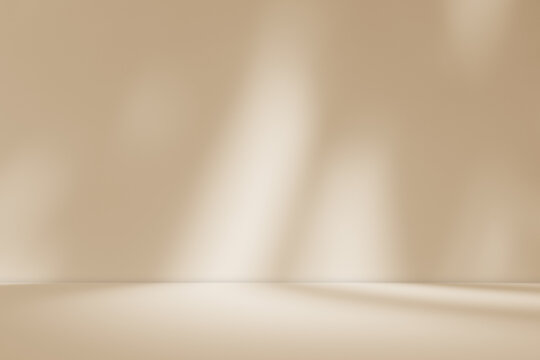 Empty brown cream beige room studio with shadow of leaves for product presentation. Autumn background. Summer tropical backdrop. Cosmetic showroom.