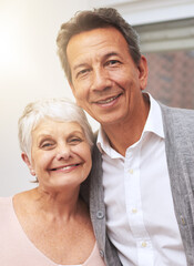 Love, senior or portrait of happy couple in home or house for bonding together with support or smile. Retirement, old people or romantic man with an elderly woman for hug, peace or care in marriage