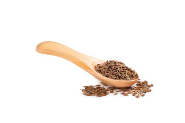 Seeds of dry cumin seasoning on a wooden spoon isolated on a white background with seeds scattered...