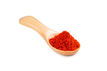 Paprika in a wooden spoon isolated on a white background. Seasoning for cooking