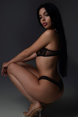 Fototapeta premium Sexy woman face. Sensual young woman posing with sexy slim body. Beautiful sexy model. Beauty female face. Sensual girl, sexy model portrait. Natural beauty.
