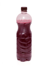 red juice wine in a plastic bottle on a white background