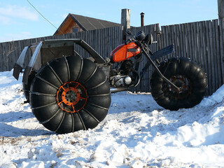 Motorcycle with big wheels in Russia.