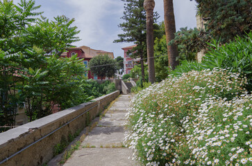 Scenic panoramic view of historic old town downtown with historic building facades, parks, the church and cruise destination Messina, Italy close to Taormina on Sicily