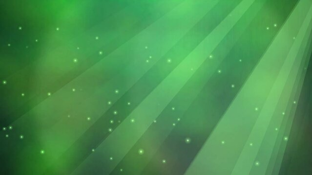 the seamless loop of a green sparkling particles background illuminated by a soft green light