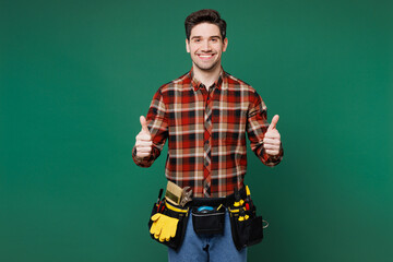 Young fun happy employee laborer handyman man wear red shirt look aside on area mock up isolated on...