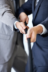 Hands, effort and tug of war with businessmen in studio for collaboration or competition. Teamwork,...