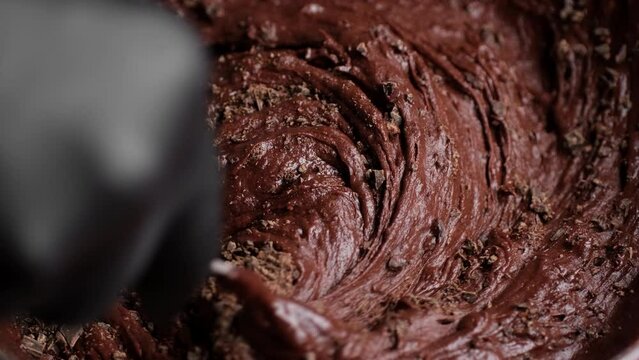sprinkle chopped chocolate in chocolate dough before cooking dessert