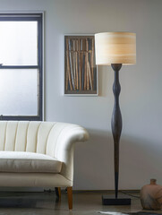 Cozy interiors composition of a room corner with a floor lamp, a sofa and natural light