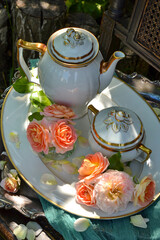 Breakfast in the garden, coffee pot on a tray