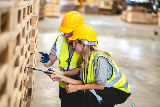 Female engineer using laptop computer for safety control checks or manufacturing maintenance work in factory building or construction site. woman engineer inspector working in industry product line
