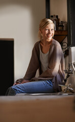 Portrait, young woman and relax at home on the kitchen counter in Australia on the weekend. Rest, female person and face for calm house and lifestyle with peaceful and casual fashion or style