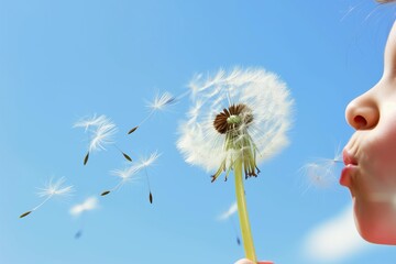 kid blowing a dandelion with seeds flying