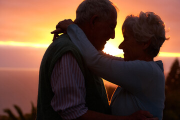 Sunset, elderly couple and hug outdoor, love and bonding for connection together in nature. Man,...