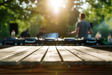 empty table surface with a background of a dj playing music at a bbq party