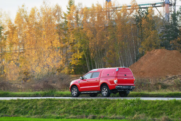 Firetruck driving on a road. Fire vehicle driving fast on a road in an emergency call. Firefighters...