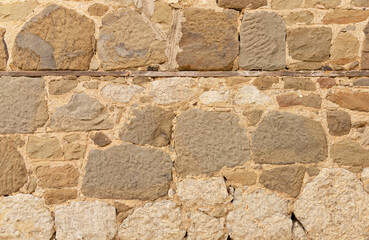 An ancient wall of stacked stone. background