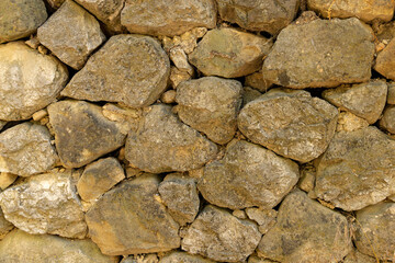An ancient wall of stacked stone. background