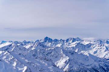 Scenic view of mountain panorama with snow covered mountain peaks in the Swiss Alps at mount Titlis on a sunny winter day. Photo taken February 21st, 2024, Titlis, Engelberg, Switzerland.