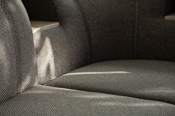 Sofa. The seat part of upholstered comfortable furniture for relaxation is covered with matting...