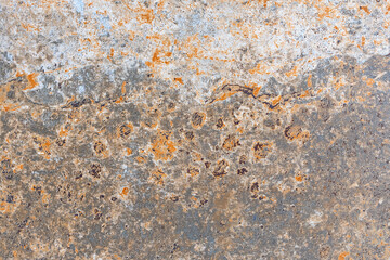 Texture of rust stains on the surface of a metal sheet.