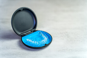 Invisible brace in the case. Taking care of dental health