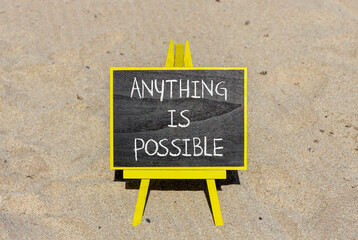 Anything is possible symbol. Concept words Anything is possible on beautiful black chalk blackboard. Beautiful sand beach background. Business anything possible concept. Copy space.