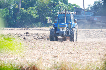 Tractors spread the soil, land plowing vehicles.