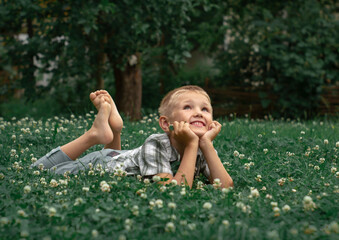 little child sitting on the grass