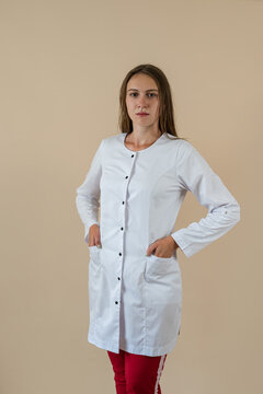 Portrait Of Pretty Young Smiling Medical Worker In Uniform