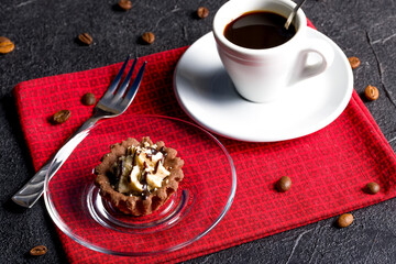 Chocolate baskets with nut cream. Homemade tartlets with cream and glaze