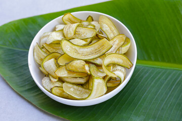 Banana chips, fried slices banana with green peel