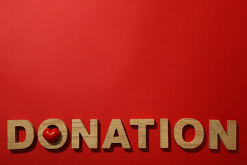 The word donation on a red background.