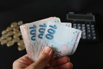 man counting Turkish money with his hand. Turkish lira banknotes. The paper currency of...