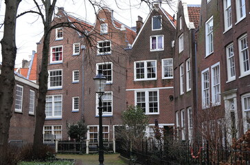 Amsterdam Begijnhof Courtyard View with Brick House Facades, Netherlands