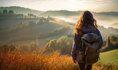 Tuscan Serenity: Against the Backdrop of a Tuscan Sunset, a Woman Tourist Walking at the Lush Fields, Captivated by Tuscany's Timeless Splendor.	
