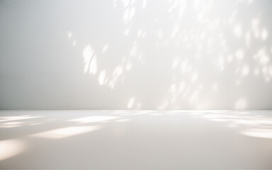 Minimalistic light background with blurred foliage shadow on a white wall. Beautiful background for presentation. - obrazy, fototapety, plakaty