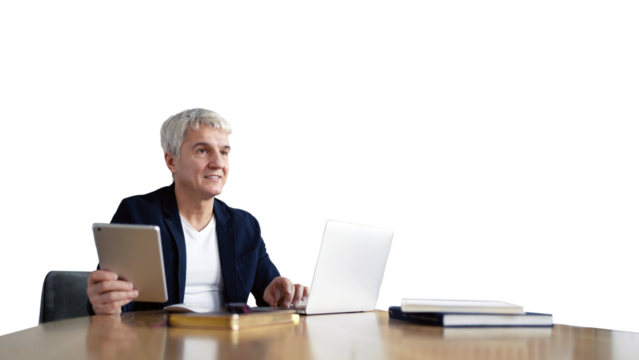 An elderly man, with graying hair, uses a laptop in the office of a worker.
- Powered by Adobe